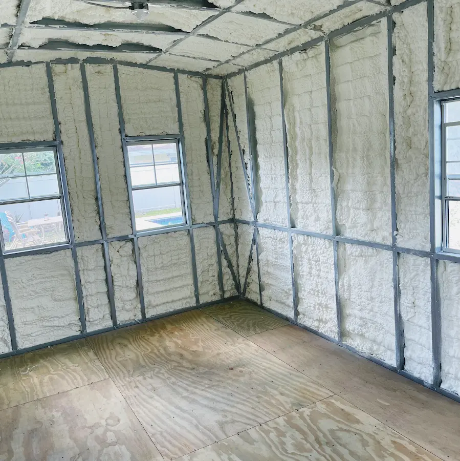 Closed-cell spray foam insulation applied to wall cavities in a residential project in Beeville